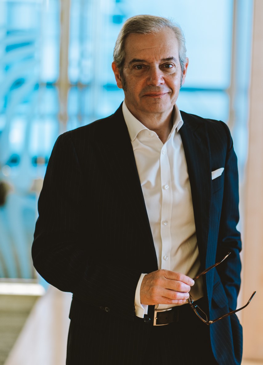 Luis M Garcia wearing glasses, seated